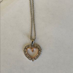 Rose gold and silver colored necklace